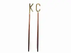 Couple of Walking Stick by Piero Fornasetti, 1913, manici in ottone realizzati a foggia di lettera "C" e "K", offered Oct 2019