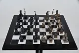 Nag Arnoldi, Scacchi, pedine in bronze