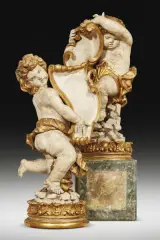 Attribuited to Giacomo Serpotta (Palermo 1656 - 1732), A pair of sculptures, lacquered and gilt wood, portraying holding-emblem putti, on circular wooden bases, 108x55x36 cm and 106x52x38 cm by Giacomo Serpotta, Attribuited to Giacomo Serpotta (Palermo, offered Oct 2023