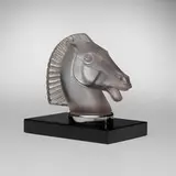 Longchamps B car mascot, model 1152B by René Lalique, c. 1929, clear and frosted glass, onyx, sold Jun 2023