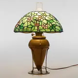 Apple Blossom table lamp by Tiffany Studios, c. 1910, leaded glass, patinated bronze, sold Jun 2023
