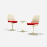 Eero Saarinen, pair of Tulip chairs, model 151 and occasional table, 1956, enameled aluminum, molded fiberglass, lacquered wood, upholstery