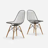 PKWs, pair by Charles and Ray Eames, 1951, enameled steel, birch, sold Feb 2017