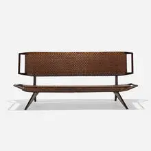 Paul Laszlo, settee, 1950, stained mahogany, cane