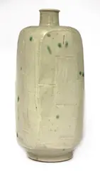 William Marshall (1923-2007) by William Marshall, in a light celadon glaze with cut sides with green spots, sold Oct 2020