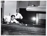 Charles Harris, (American/Pittsburgh, 1908-1998), Sam Milai aiming cue, with Steve Poole standing in background, for billiards tournament at Centre Avenue YMCA, taken