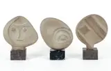 Henry Bursztynowicz, Lunar Phase I, II and III, circa 1975, set of three, carved sandstone sculptures on marble bases, approximately 14.5 inches tall