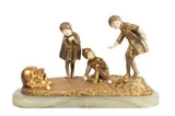 Demetre Chiparus, Children Playing Boules (Fillettes Au De Passe-Boules), bronze and ivory on stone base