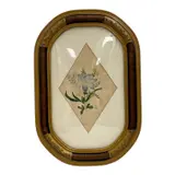 This original 1903 watercolor painting by the renowned French-American floral artist Paul de Longpré features a delicate botanical arrangement highlighting a central blue blossom flanked by smaller yellow and purple wildflowers. Executed with the artist’s characteristic precision and soft tonal gradations by "Floral Bouquet" by Paul de Longpre, Watercolor on paper, offered Jun 2026