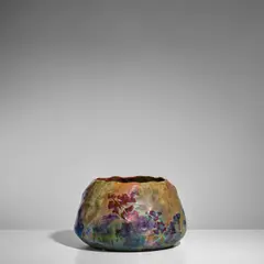 Cachepot by Lucien Lévy-Dhurmer, for Clément Massier, earthenware with iridescent glaze, impressed and painted marks 'CLEMENT MASSIER GOLFE JUAN (AM)', sold Sep 2025
