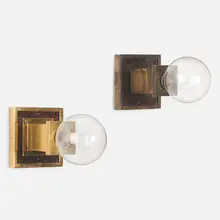 Wall sconces, assembled pair by Frank Lloyd Wright, c. 1915, brass, mahogany, sold Mar 2023