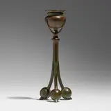 Tripod candlestick by Tiffany Studios, c. 1910, patinated bronze, sold Mar 2023