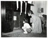 Charles Harris, (American/Pittsburgh, 1908-1998), Sylvia and Lenora Simpson looking up chimney with Christmas stockings in domestic interior, taken 1945, later