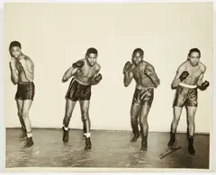 (American/Pittsburgh, 1908-1998), Group portrait of four boxers posing in gym, possibly Centre Avenue YMCA, taken c.1938-1946, printed shortly after, glossy by Charles Harris, photograph, offered May 2024