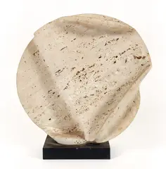 Splitting Disc II (Folded Slab Number 45), 1983, polished and by Henry Bursztynowicz, carved travertine marble on slate base, offered Apr 2024