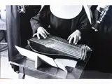 Pepi Merisio, Suora che suona la cetra da tavolo 1970, vintage gelatin-silver print on baryta paper