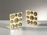 Coppia di fermalibri della serie MONETE by Piero Fornasetti, offered Jan 2021