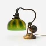 Counterbalance desk lamp by Tiffany Studios, c. 1905, patinated bronze, hand-blown Favrile glass, sold Mar 2023