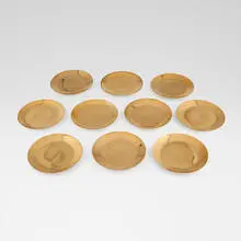Piero Fornasetti, Collection of eighteen plates, c. 1970, glazed and gilt porcelain