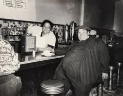 Lawren Harris, Teenie (American/Pittsburgh, 1908-1998), Man at the Lunch Counter in Pinstripe Suit, taken c. late 1940s, printed c.1980s, matte, photograph