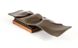 Ron Bennett, Landscape Forms, cast, bronze on a wood base, 16.25 W x 4.5 D x 2.5 T inches. Provenance: from the esta