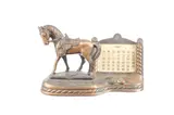 Untitled by Carlsbad Caverns, bronze horse perpetual calendar, offered Jul 2024