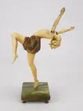 Ferdinand Preiss, Art Deco sculpture ''Torch Dancer''a cold-painted, bronze and ivory figure set on green onyx base, missing torches, detached from b