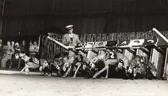 Gjon Mili, Racing Greyhounds breaking out of the starting gate at Wonderland track, Revere, MA, 1948, Gelatin silver print; titled and annotated on the verso with artist's and Time Inc. stamps