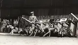 Gjon Mili, Racing Greyhounds breaking out of the starting gate at Wonderland track, Revere, MA, 1948, Gelatin silver print; titled and annotated on the verso with artist's and Time Inc. stamps