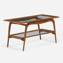 Coffee table by Modern, c. 1950, walnut, glass, mahogany, brass, sold Nov 2022