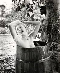 Bunny Yeager, black and white, photograph of woman bathing in barrel