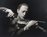 George Hurrell, Portrait of Jascha Heifetz playing Violin, image taken 1937, printed later, signed and marked 224/250 in black