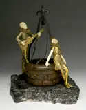 - Serenade by the Wishing Well- by René Paul Marquet, bronze and ivory sculpture set on stone base, sgined and, offered Dec 2019