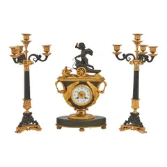 Untitled by Empire Style Gilt and Patinated, bronze clock garniture, offered Feb 2026