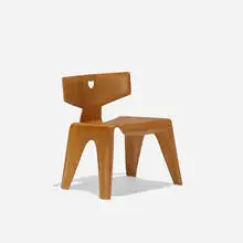 child's chair by Charles and Ray Eames, 1945, walnut plywood, sold Sep 2016