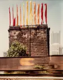 Joel Meyerowitz, Untitled (Jody Pinto Flag Installation on Pointe Bridge Piers from 1984 TRAF)