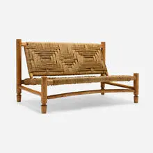 Settee by Adrien Audoux and Frida Minet, c. 1955, carved wood, raffia, sold Jan 2026
