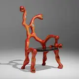 Chaise serpent by Niki de Saint Phalle, 1996, carved, laminated and stained birch, stained satinwood with mirrored, painted, and clear glass, sold Sep 2022