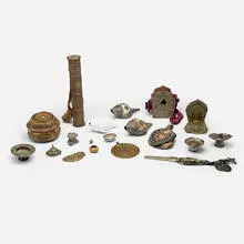 Tibetan and Mongolian, Collection of eighteen artifacts, repoussé and hand-chased mixed metals, copper, silver gilt, shell, painted wood, fabric, leather, woven fabric, turquoise, coral