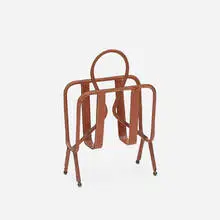Jacques Adnet, magazine stand, c. 1950, saddle-stitched leather, brass