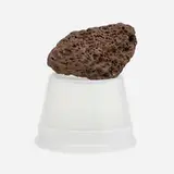 Tony Feher, Untitled (CFMX 75), 2004, intrusive basaltic rock, approximately 30 million years old, and inverted 16 oz. #5 polypropylene deli container of a contemporary date