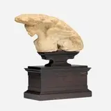 Graeco-Roman, Fragment of a female Sphinx, carved marble