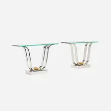 Tulip Style consoles, pair by Karl Springer, c. 1970, mirror-polished stainless steel, brass, sold Jul 2016
