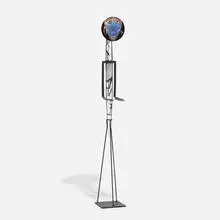 Ann Wolff, Nuts Daughter, 1988, blown rondel, line and brush etchings, sandblasted crystal body with fired black enamels, forged iron details