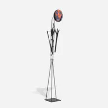 Ann Wolff, Nuts Daughter, 1988, blown rondel, line and brush etchings, sandblasted crystal body with fired black enamels, forged iron details