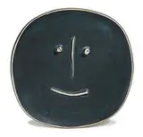 Patinated Face by Pablo Picasso, 1959, Plate of white earthenware clay, engobe and patina decoration with scraped relief, sold Oct 2014