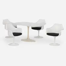 Dinette suite by Eero Saarinen, c. 1975, lacquered fiberglass, lacquered aluminum, laminate, upholstery, sold Sep 2025