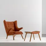 Senza titolo by An Armchair With Ottoman Attributed To H. Wegner, offered Feb 2026