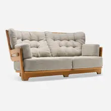 Denis sofa by Robert Guillerme & Jacques Chambron, c. 1970, oak, upholstery, sold Jul 2025