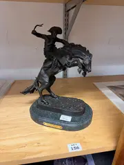 Untitled by Frederic Remington, bronze, bronco buster., offered May 2025